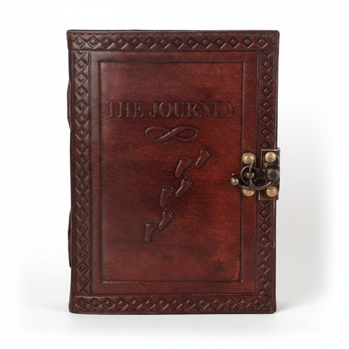 Retkatha handcrafted dark brown leather journal with embossed The Journey text, footprints, and vintage metal clasp.