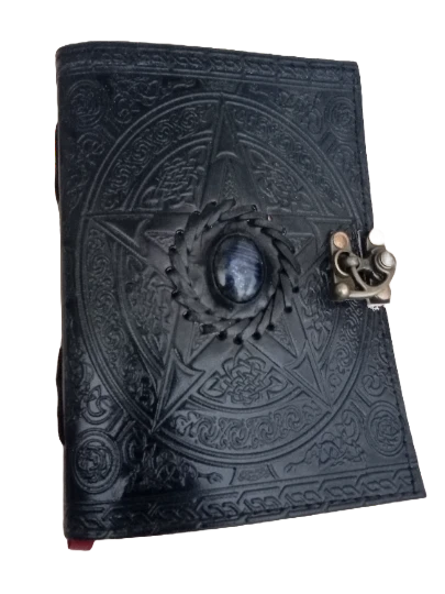 Retkatha handcrafted black leather journal with embossed pentagram, blue gemstone, and antique brass clasp lock.
